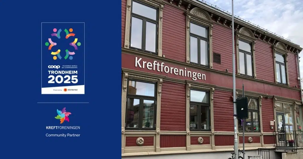 Skilt med "Kreftforeningen" på en rød bygning utvendig ved siden av en plakat for COOP FIS nordiske ski-VM Trondheim 2025.